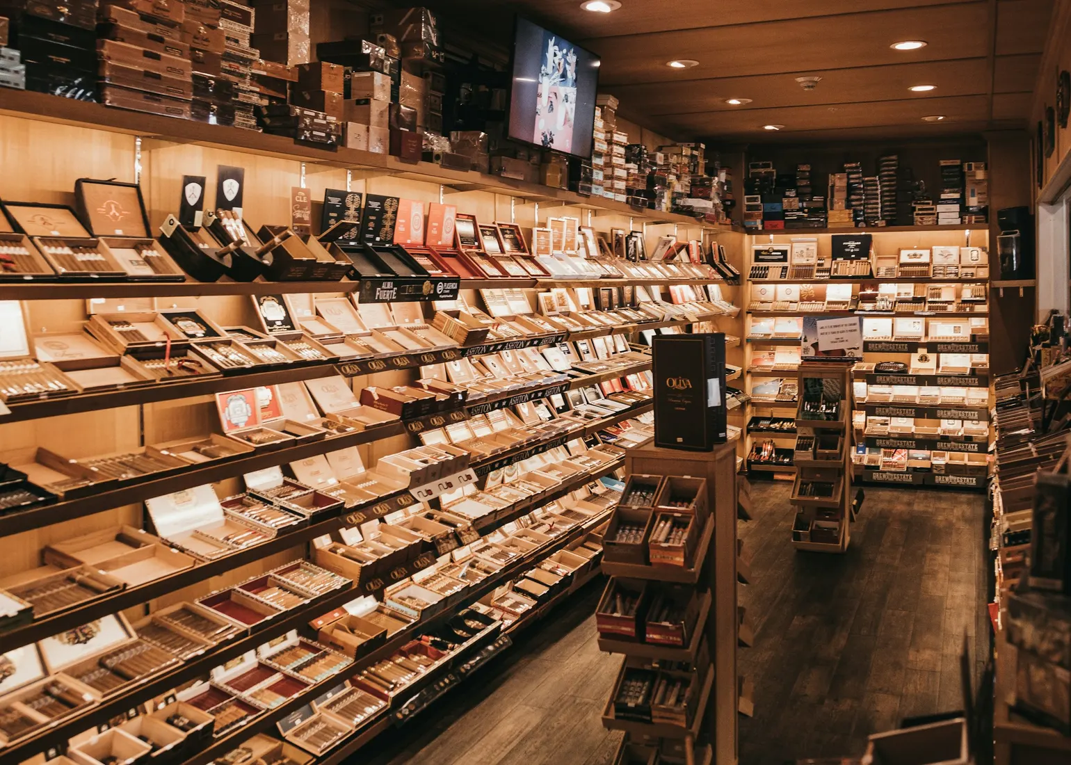 Open cigar boxes stacked in a humidor