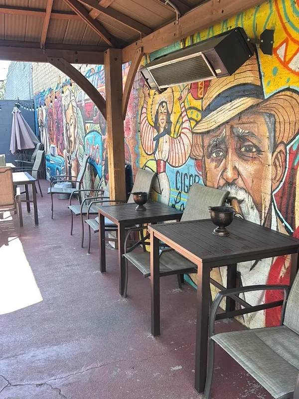 The Puro Humo patio with its hand-painted mural