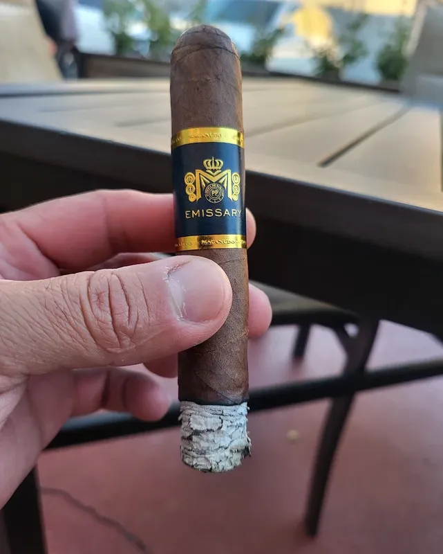 A cigar resting on the Puro Humo patio