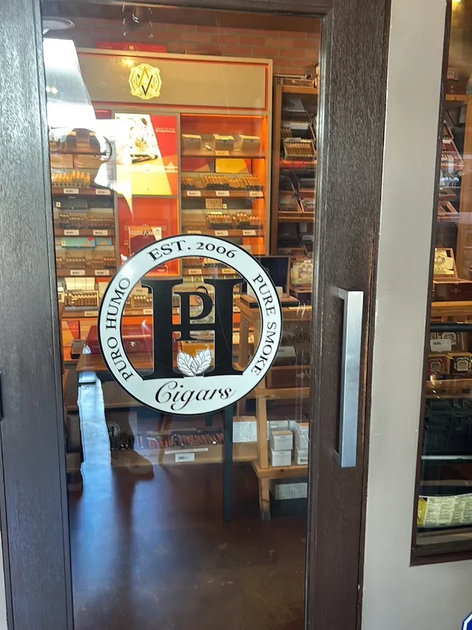 The Puro Humo humidor door with the lounge logo